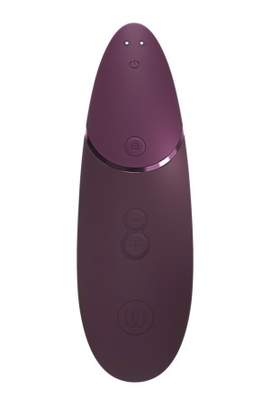 Stimulateur clitoridien violet sur fond neutre