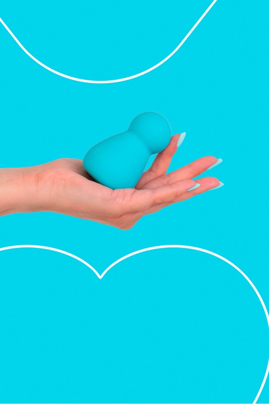 Fairygasm Applust vibrator in blue held in hand, showing size and texture