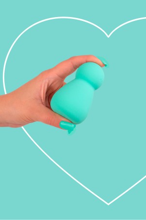 Fairygasm Applust vibrator in green held in hand, showing curves and details