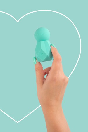 Fairygasm BlissKey Vibrator grün in der Hand gehalten, zeigt Kurven und Verarbeitung