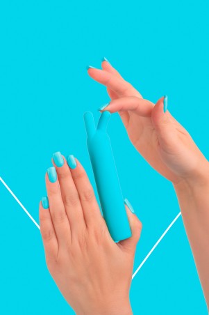 Fairygasm BlissStars vibrator blue held in hand, showing size and texture