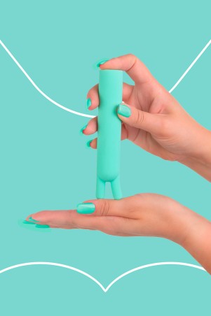 Fairygasm BlissStars vibrator green held in hand, showing curves and details
