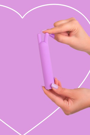 Fairygasm BlissStars vibrator purple held in hand, highlighting texture and ergonomics