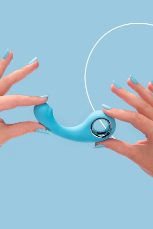 Fairygasm BraveryAward vibrator blue held in hand, showing size and texture