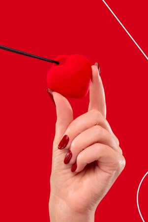 Fairygasm PleasureStone red held in hand