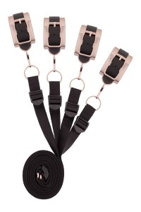 Kit cinghie da letto Rosy Gold arrotolato con dettagli rosé