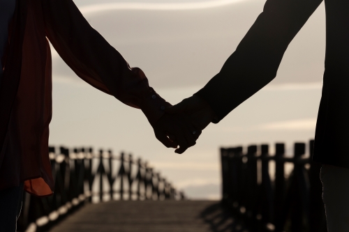 Couple holding hands - rebuilding intimacy after cancer