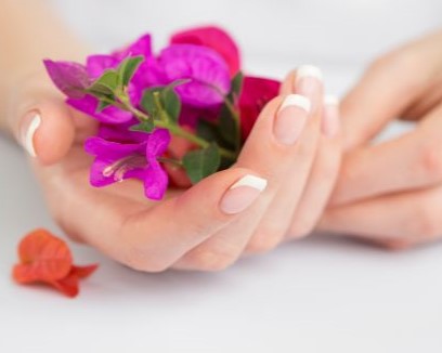 Female hands holding a flower - rediscovering pleasure after breast cancer